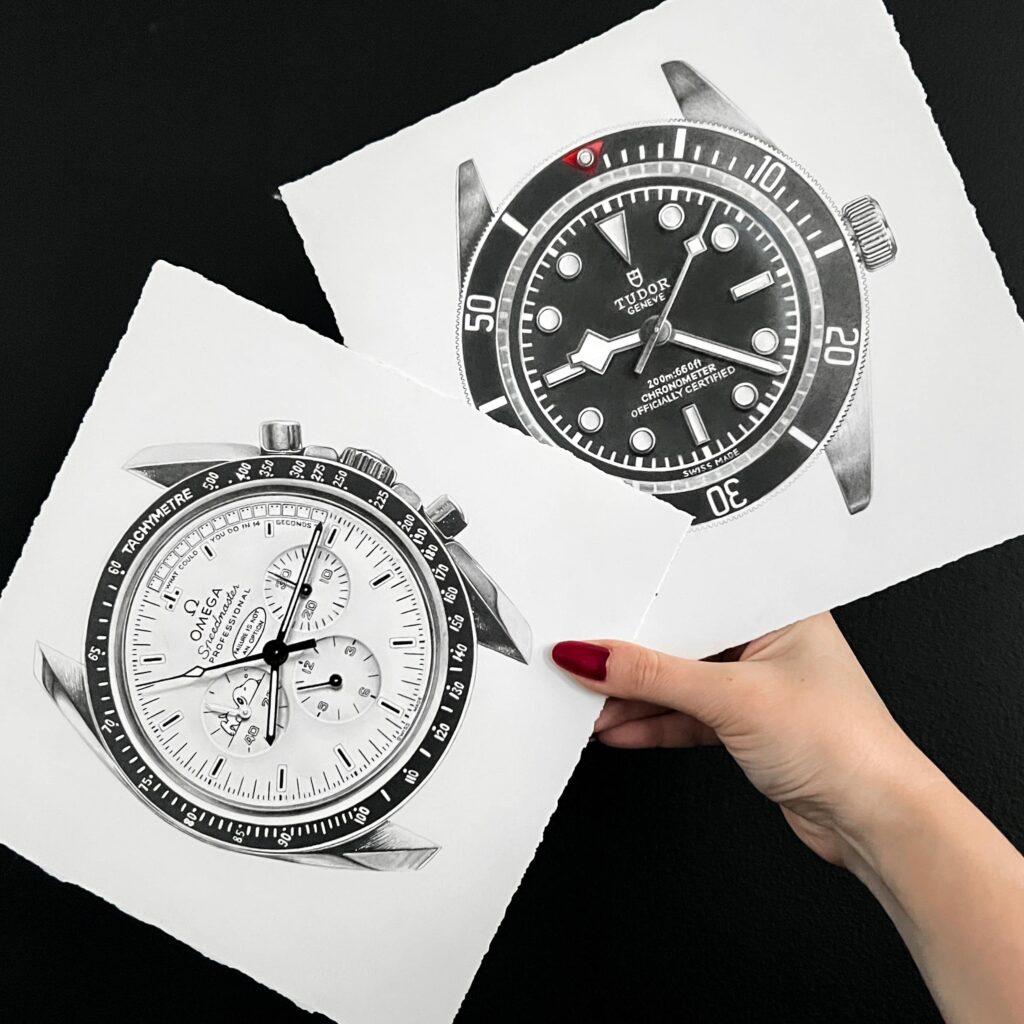 The image showcases two hyperrealistic black-and-white drawings by Sinziana Iordache, held by a hand with neatly painted red nails. The drawings feature luxury wristwatches rendered with stunning precision: Left watch showcases Omega Speedmaster Snoopy anniversary with chronograph sub-dials, a tachymeter bezel, and intricate detailing that highlights the technical and aesthetic appeal of the timepiece. Right watch displays a Tudor Black Bay 85, a dive watch style, with a rotating bezel, bold markers, and distinctive branding, along with the text "Chronometer Officially Certified" on the dial. Both drawings are presented on torn-edged paper against a black background, emphasizing the meticulous artistry. Sinziana Iordache's exceptional skill in capturing fine details and creating a lifelike, three-dimensional effect is evident in these works, making them a stunning tribute to the beauty of luxury timepieces. Small Commission Watch Drawing